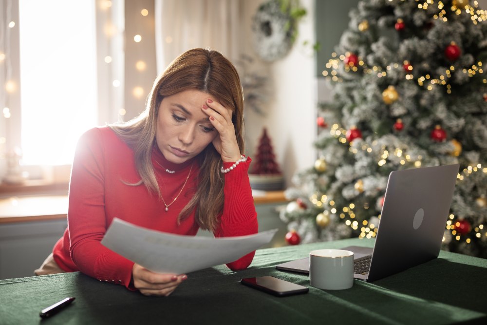 Woman reviewing bills during the holiday season